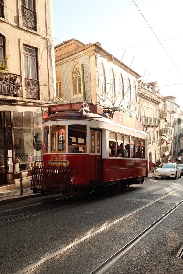 Red vintage tram on a sunny street