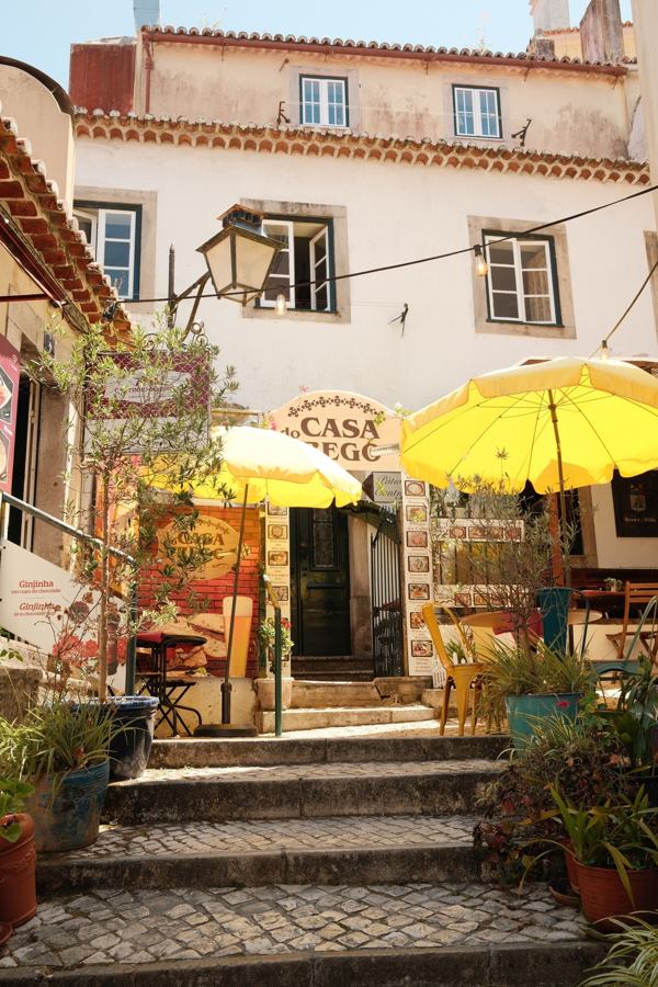 Café steps with yellow umbrellas