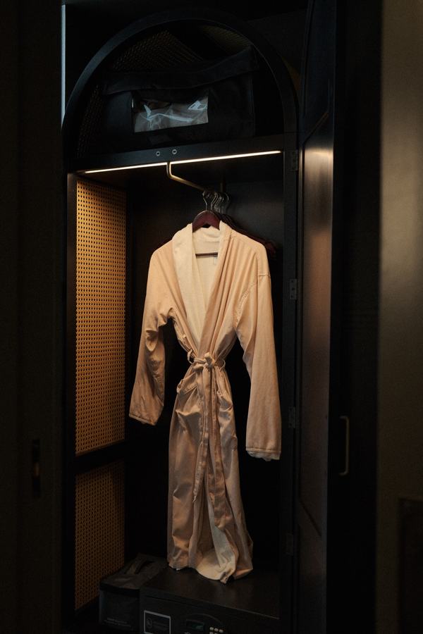 Robe hanging in a softly lit wardrobe