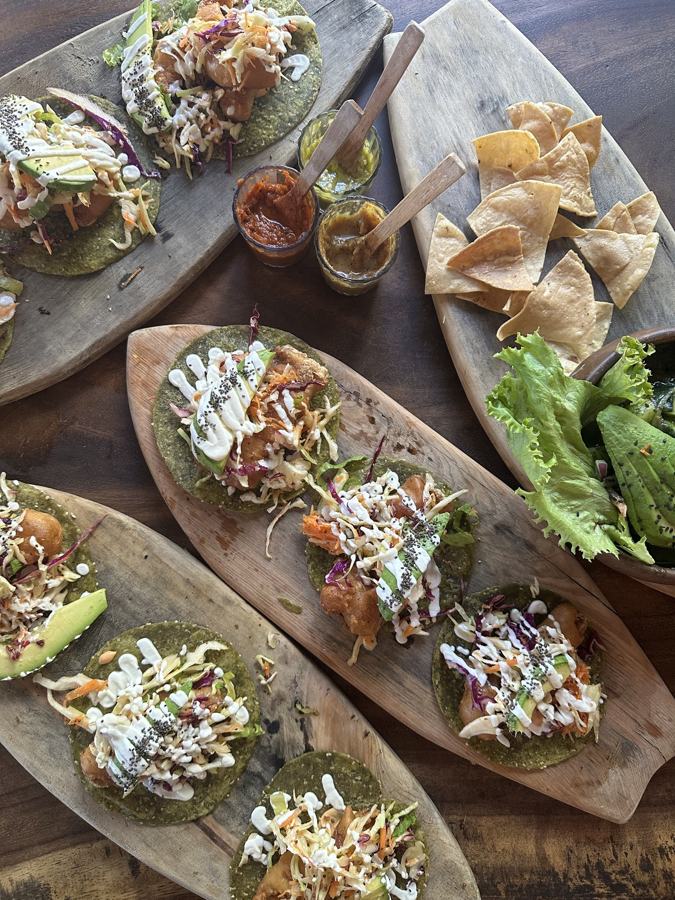 Tacos served on wooden boards
