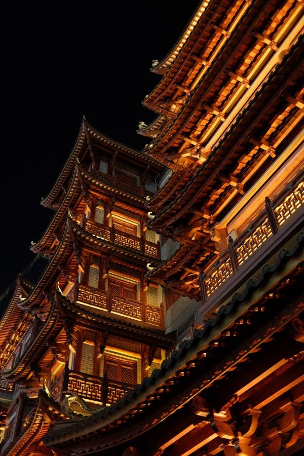 Traditional pagoda roofs lit at night